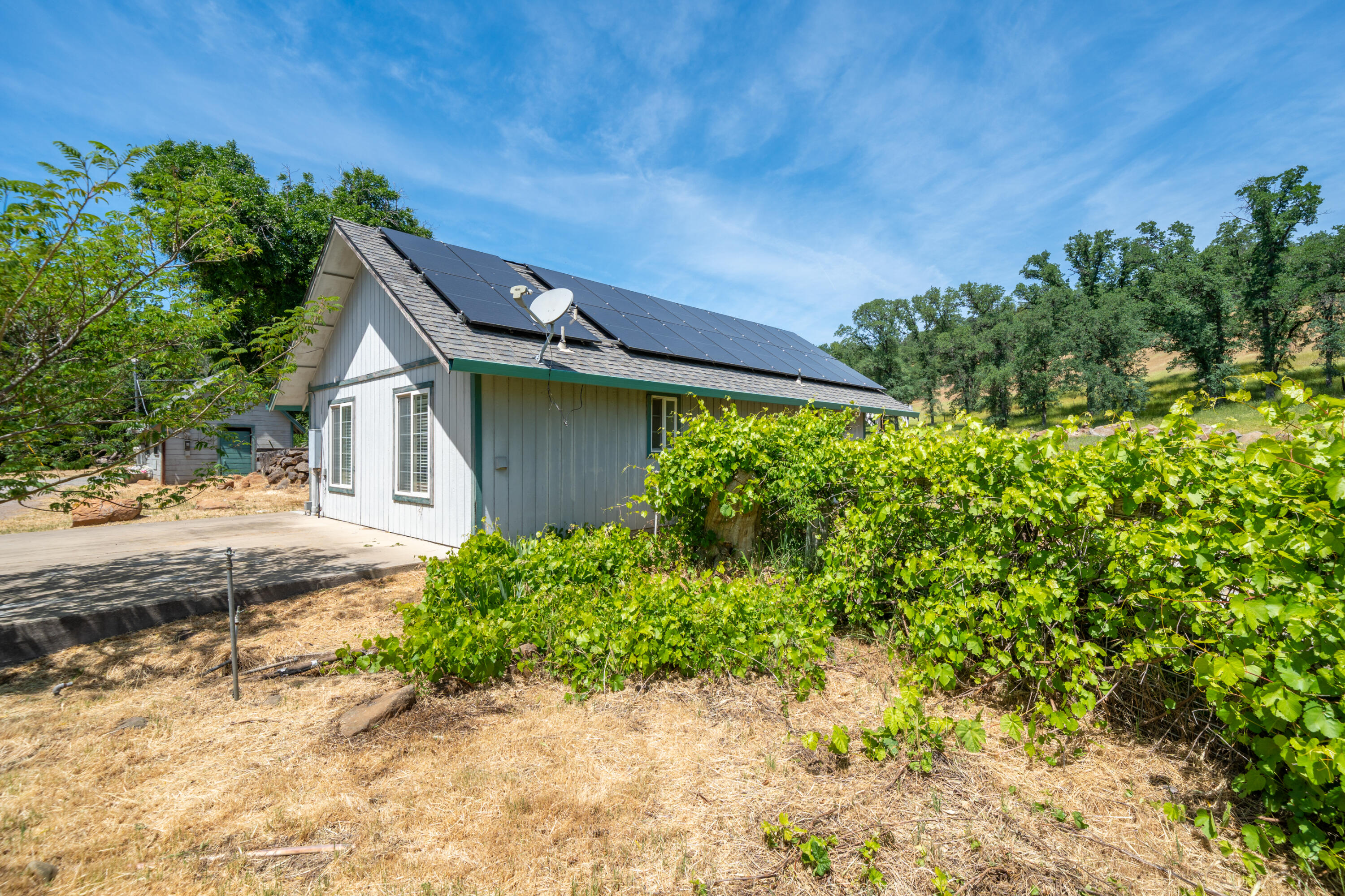 24294 Dersch Road Shingletown, CA 96088 - Photo 11 of 34 a house view with a backyard space
