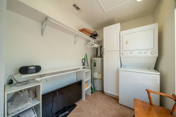 a view of storage and utility room with washer and dryer