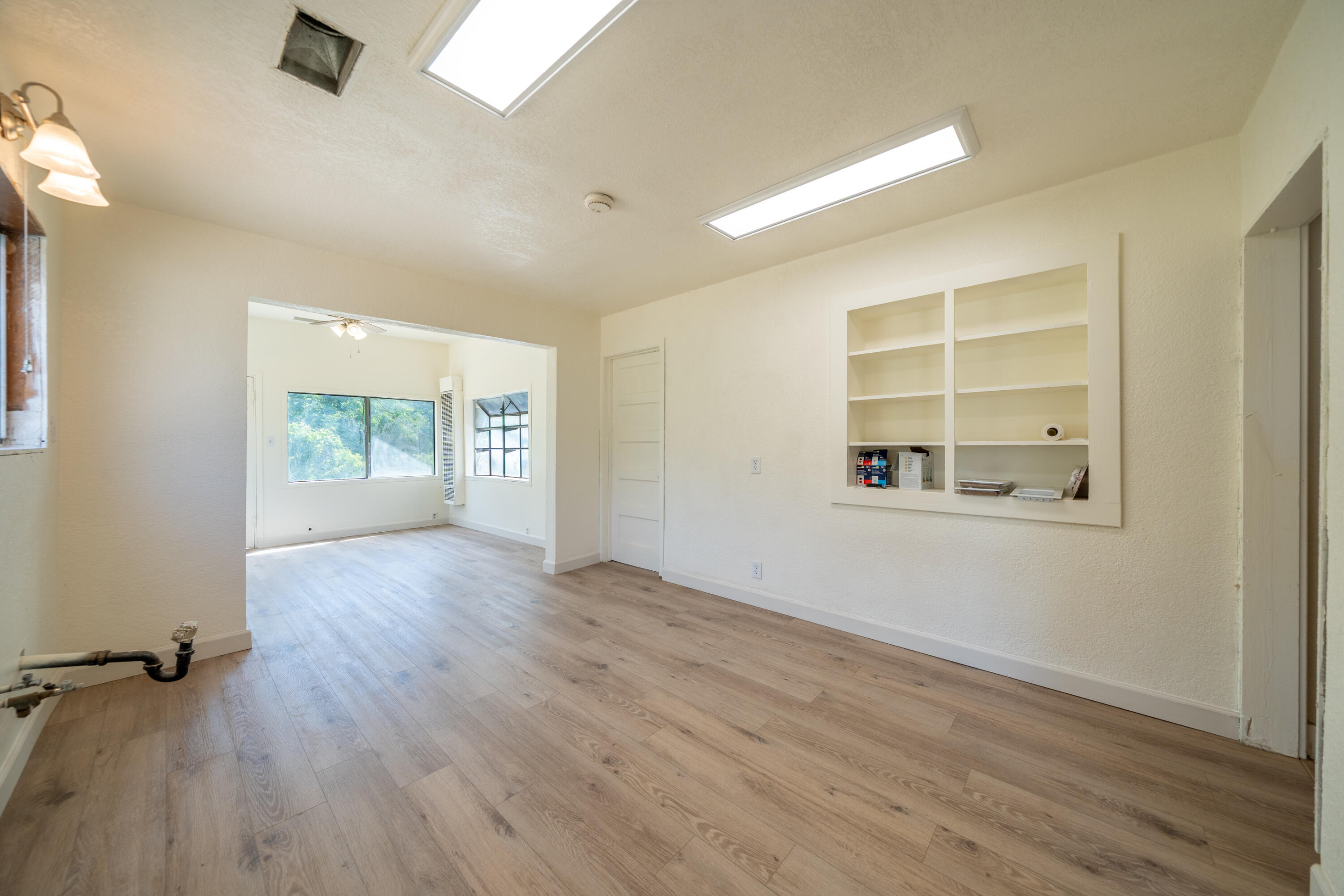 24294 Dersch Road Shingletown, CA 96088 - Photo 17 of 34 wooden floor in an empty room with a window