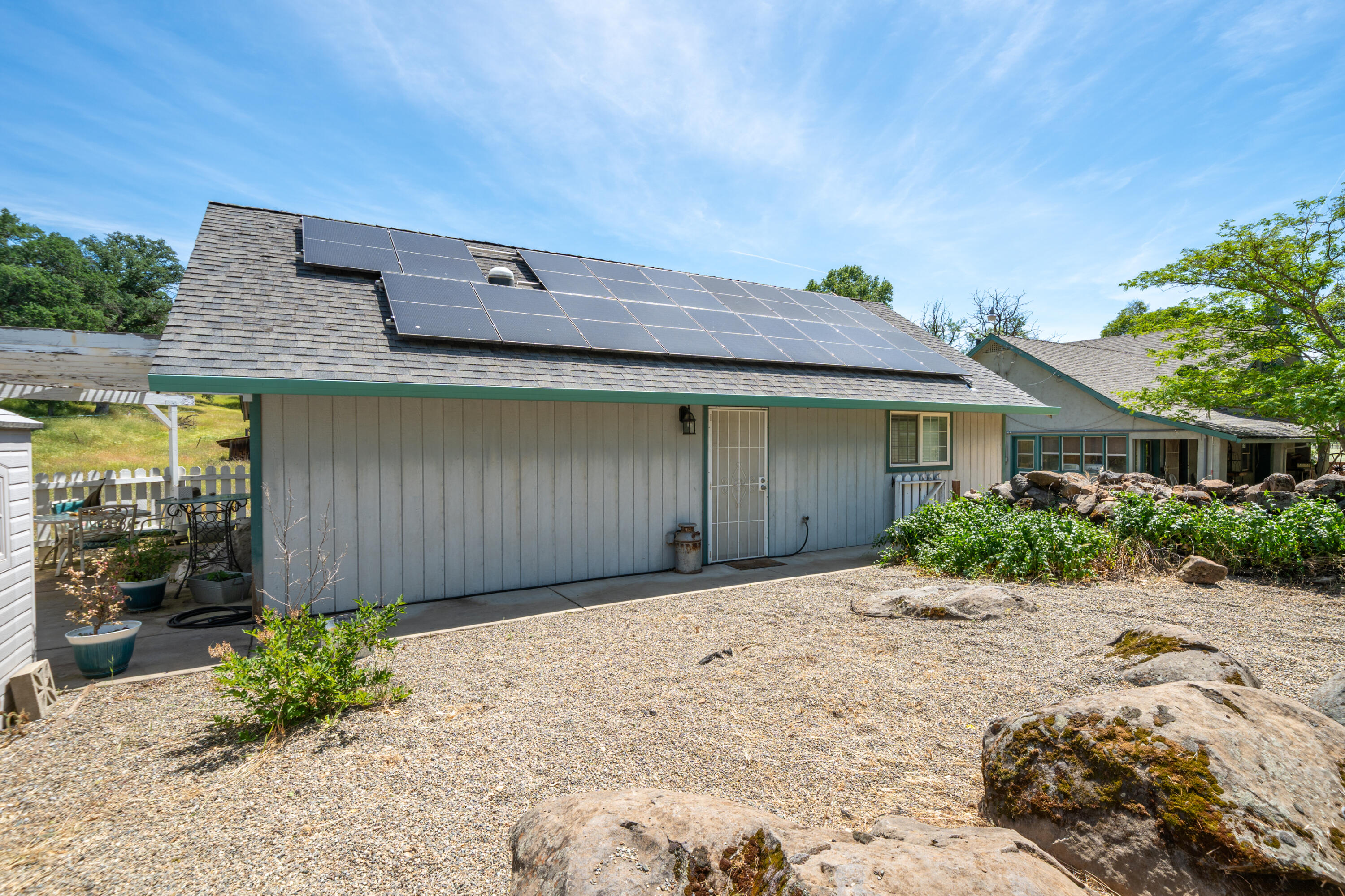 24294 Dersch Road Shingletown, CA 96088 - Photo 25 of 34 a front view of a house with a garden