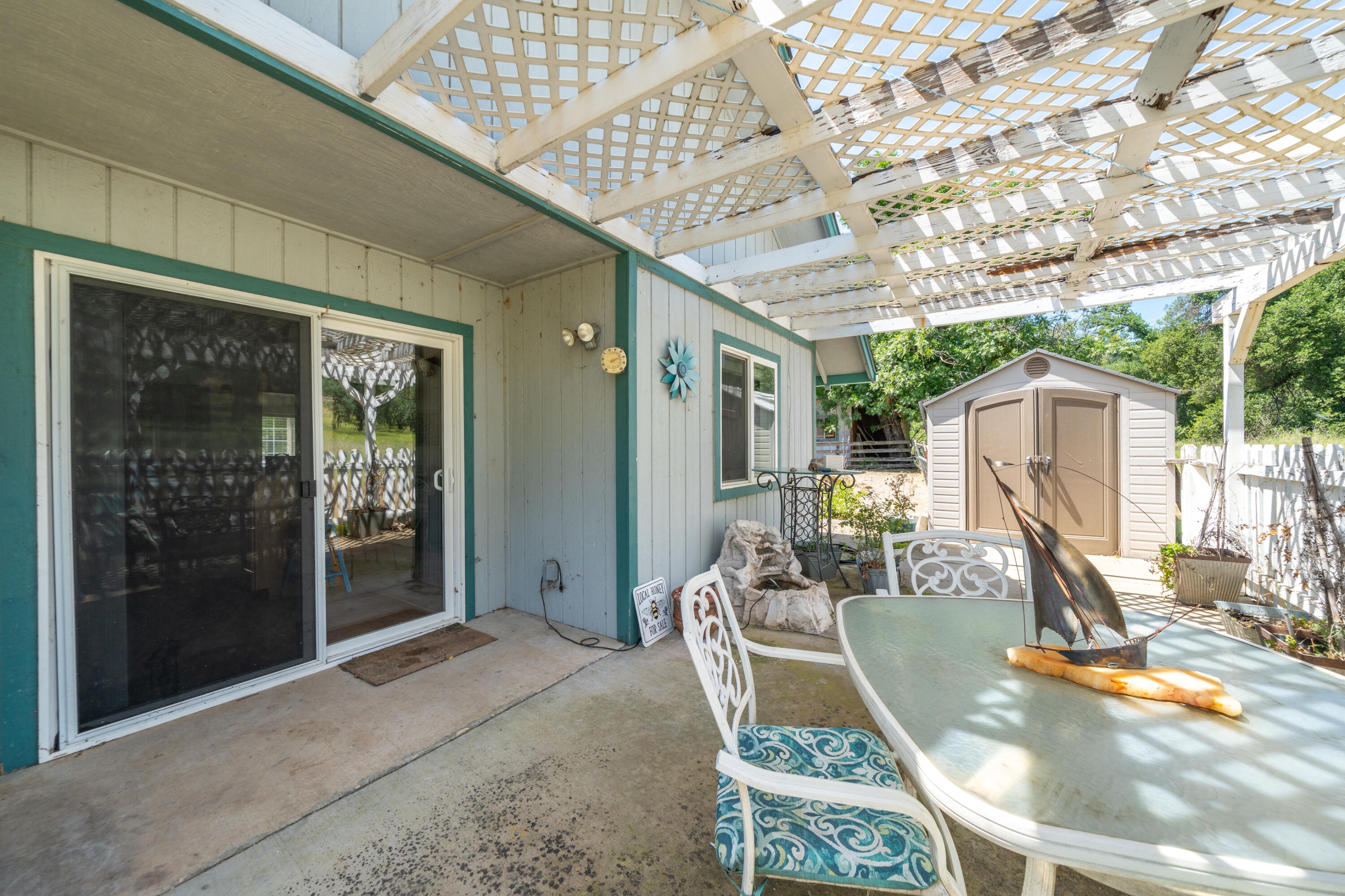 24294 Dersch Road Shingletown, CA 96088 - Photo 31 of 34 a view of a patio with table and chairs and potted plants