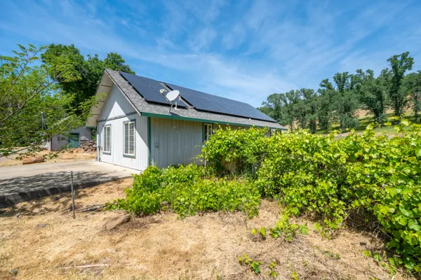 a house view with a backyard space