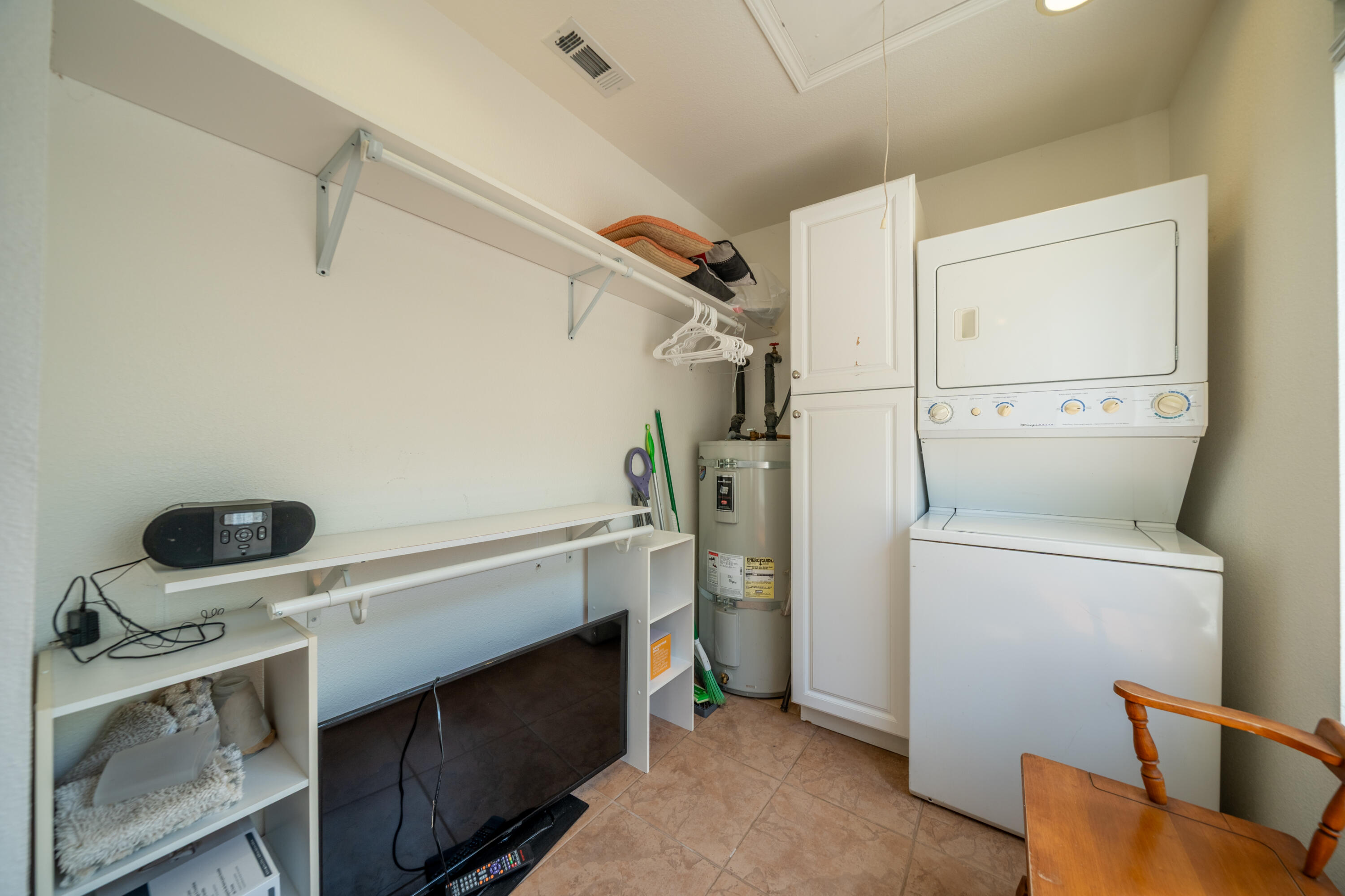 24294 Dersch Road Shingletown, CA 96088 - Photo 10 of 34 a view of storage and utility room with washer and dryer
