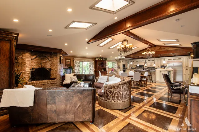 a living room with patio furniture and a flat screen tv