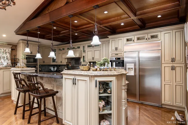 a kitchen with kitchen island a counter top space a sink appliances and cabinets