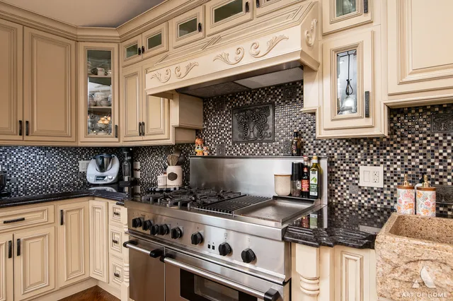 a kitchen with a stove and cabinets