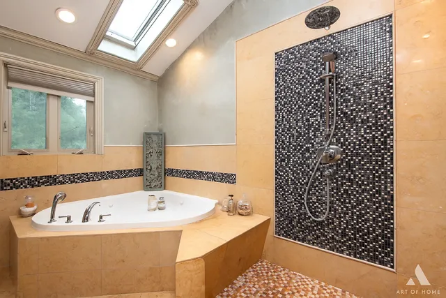 a bathroom with a bathtub and shower