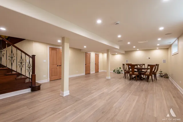 a view of an empty room with furniture and a chandelier