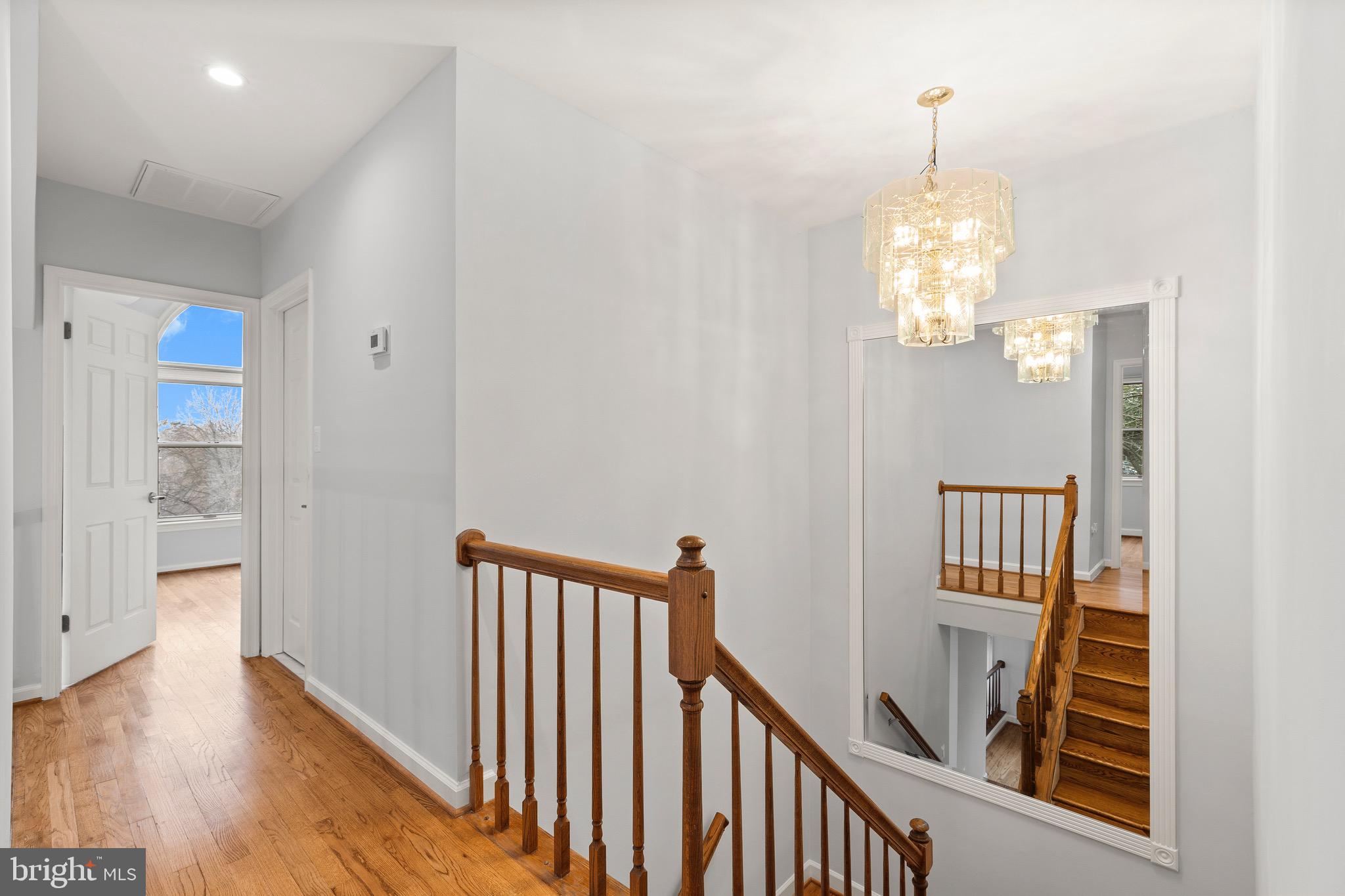 1474 Hampton Hill Circle McLean, VA 22101 - Photo 14 of 45 a view of a hallway with wooden floor and staircase