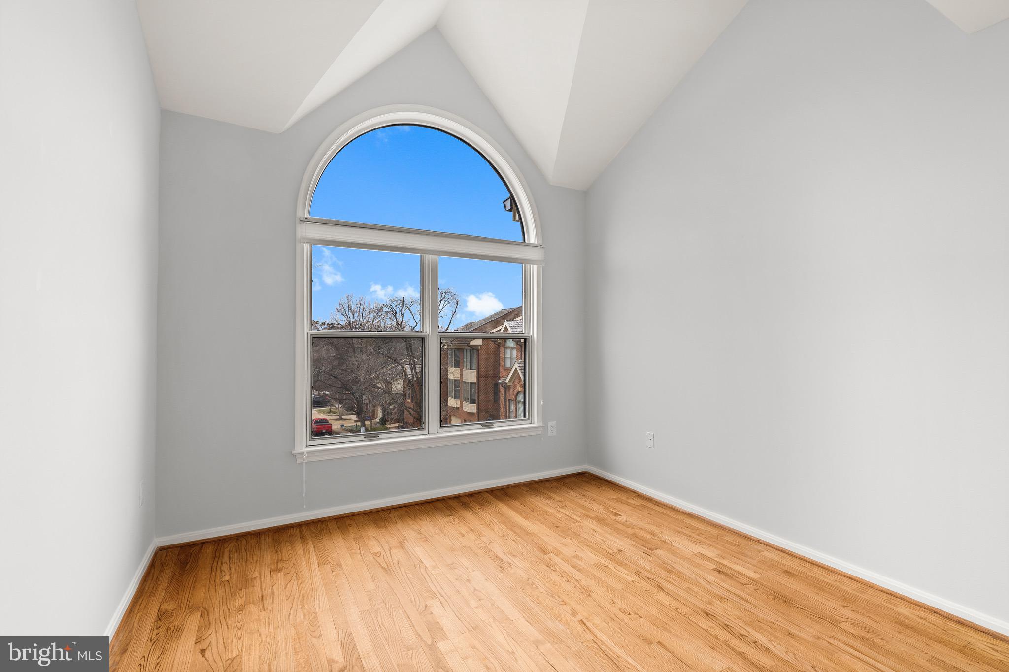 1474 Hampton Hill Circle McLean, VA 22101 - Photo 23 of 45 a view of empty room with wooden floor and fan