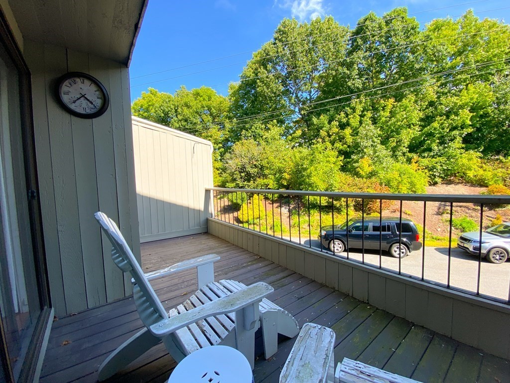 4 Mill Pond, Unit 4 North Andover, MA 01845 - Photo 3 of 6 a view of a balcony with chairs