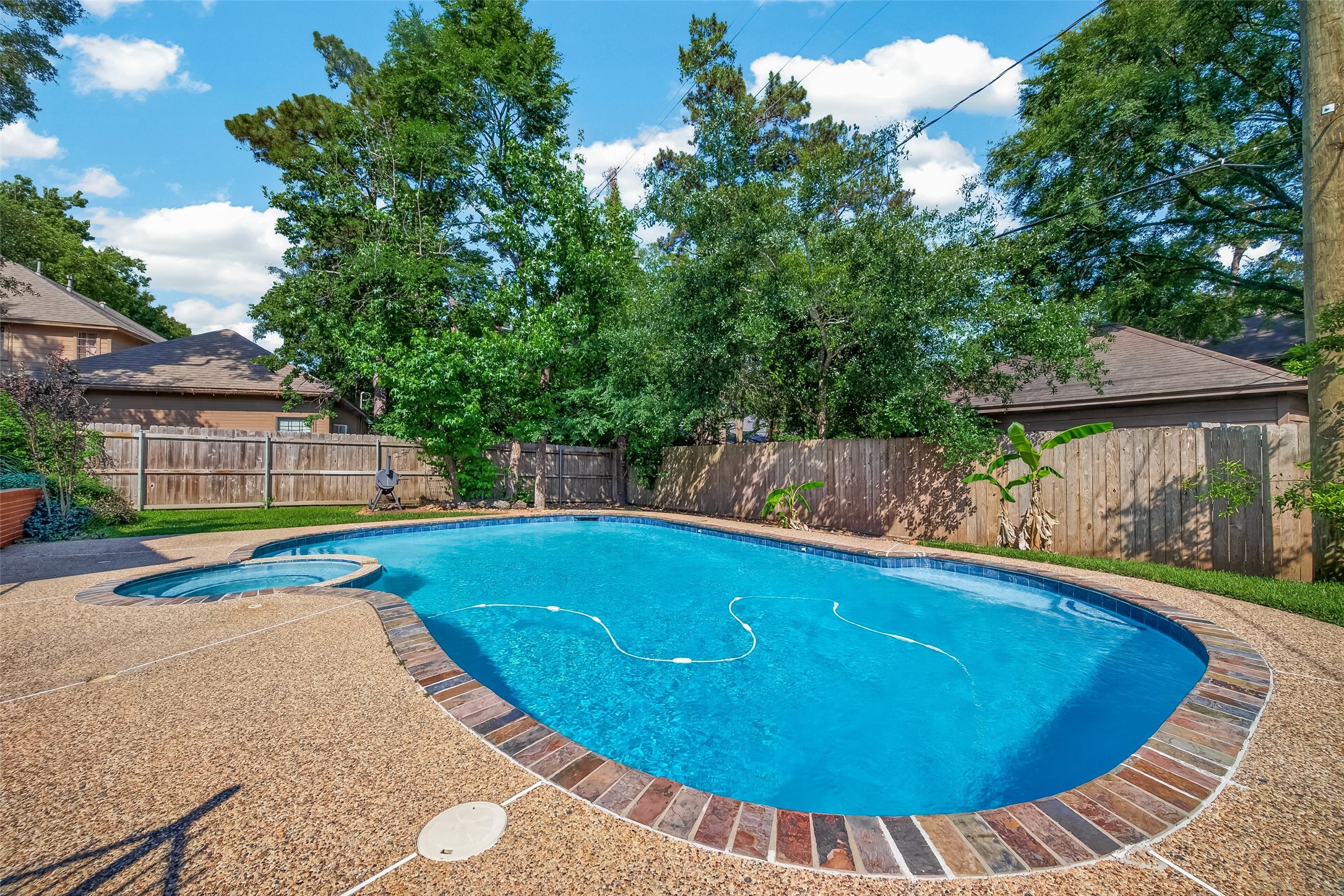 6131 Hampton Way Court Spring, TX 77389 - Photo 43 of 50 a view of a swimming pool with a patio and yard