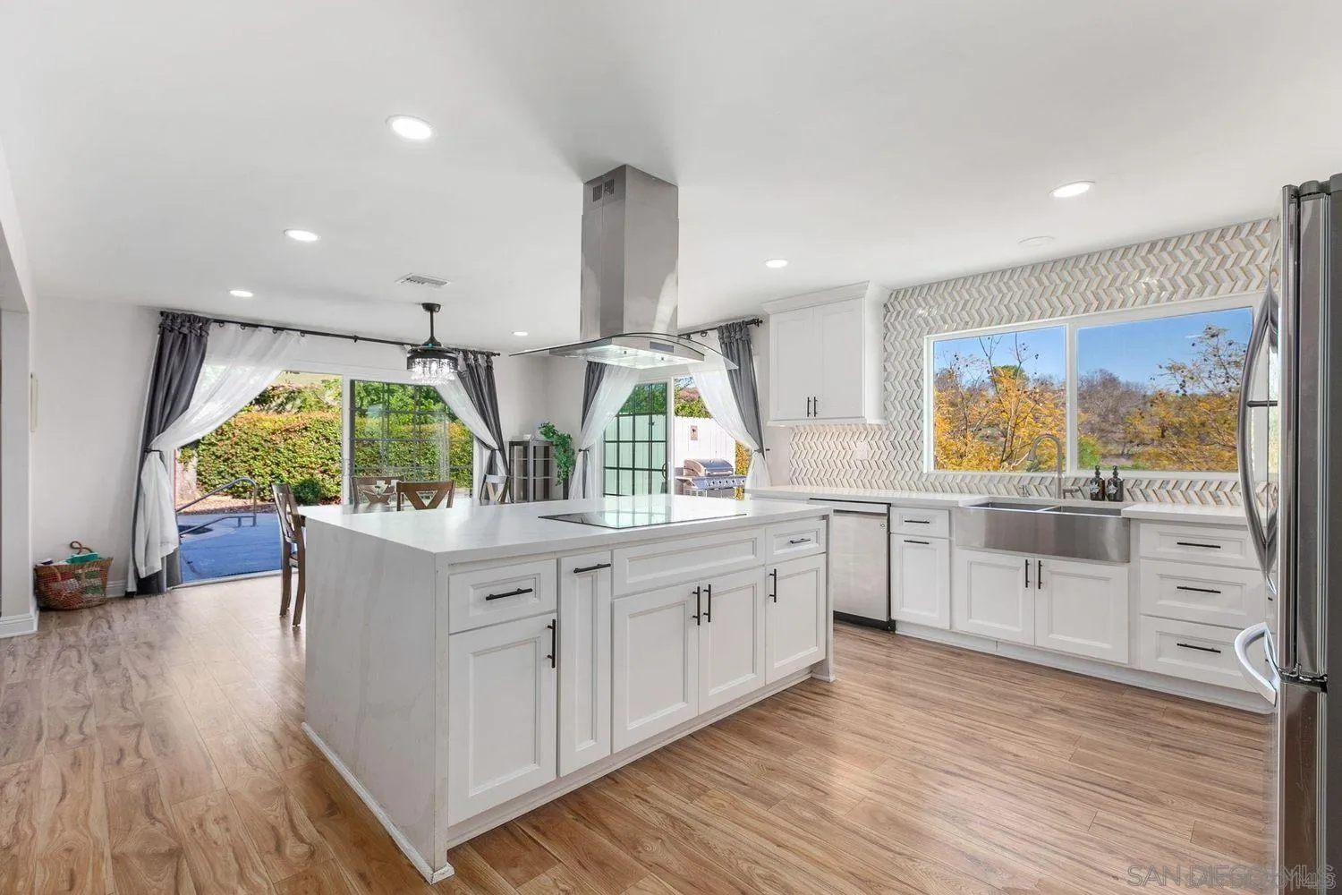 9431 West Lilac Road Escondido, CA 92026 - Photo 11 of 62 a kitchen with counter top space and windows