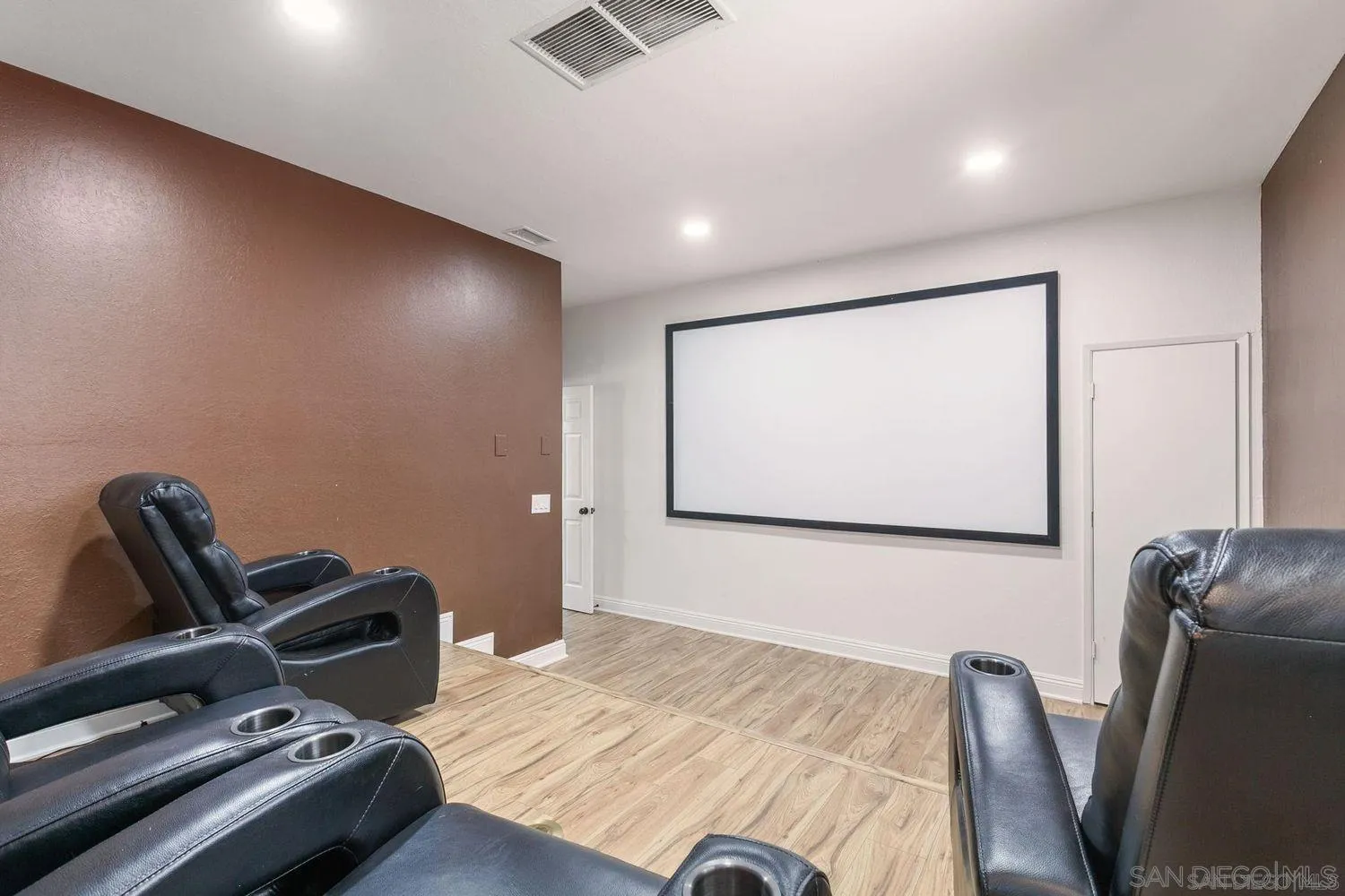 9431 West Lilac Road Escondido, CA 92026 - Photo 18 of 62 a bedroom with furniture and a projector