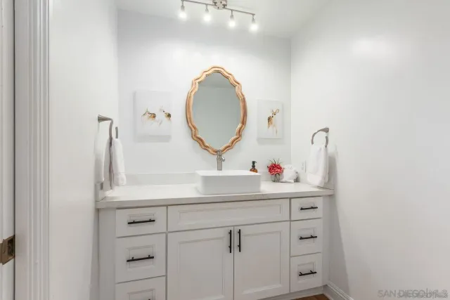 a bedroom with a large bed and a large window
