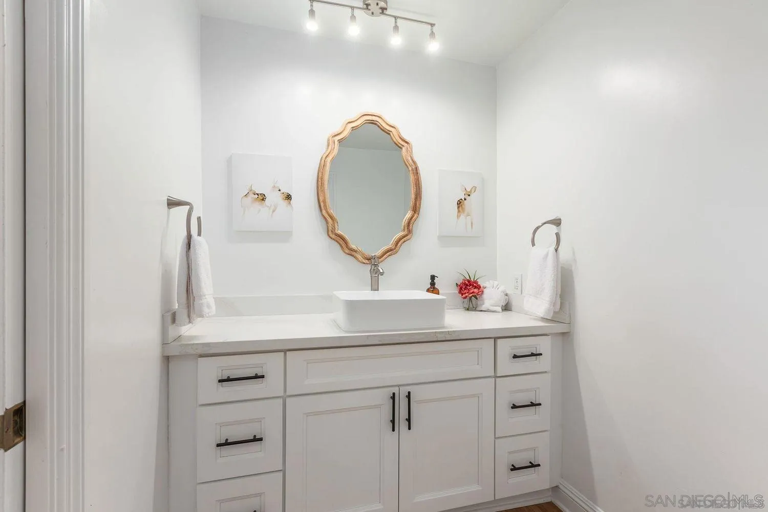 9431 West Lilac Road Escondido, CA 92026 - Photo 19 of 62 a bathroom with a sink and a mirror