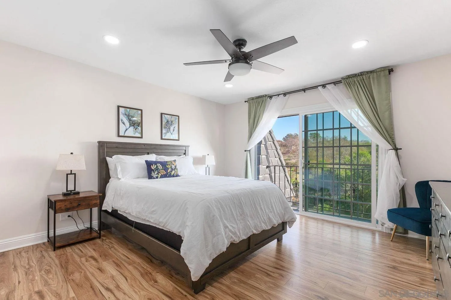 9431 West Lilac Road Escondido, CA 92026 - Photo 31 of 62 a bedroom with a bed and a large window