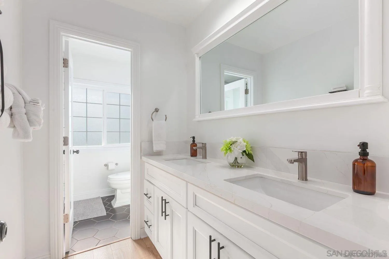 9431 West Lilac Road Escondido, CA 92026 - Photo 33 of 62 a bathroom with a sink a toilet and shower