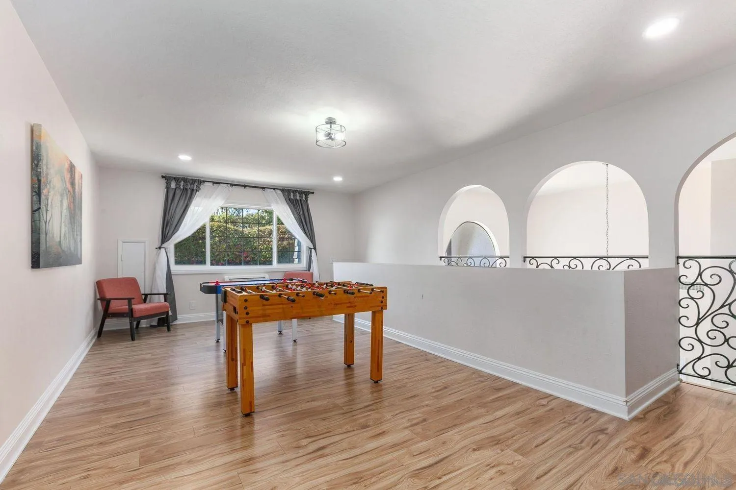 9431 West Lilac Road Escondido, CA 92026 - Photo 36 of 62 a view of a livingroom with furniture and wooden floor