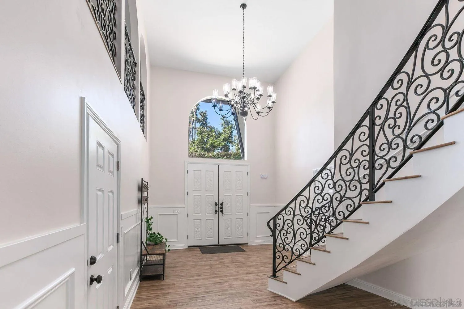 9431 West Lilac Road Escondido, CA 92026 - Photo 7 of 62 a view of entryway with stairs and wooden floor