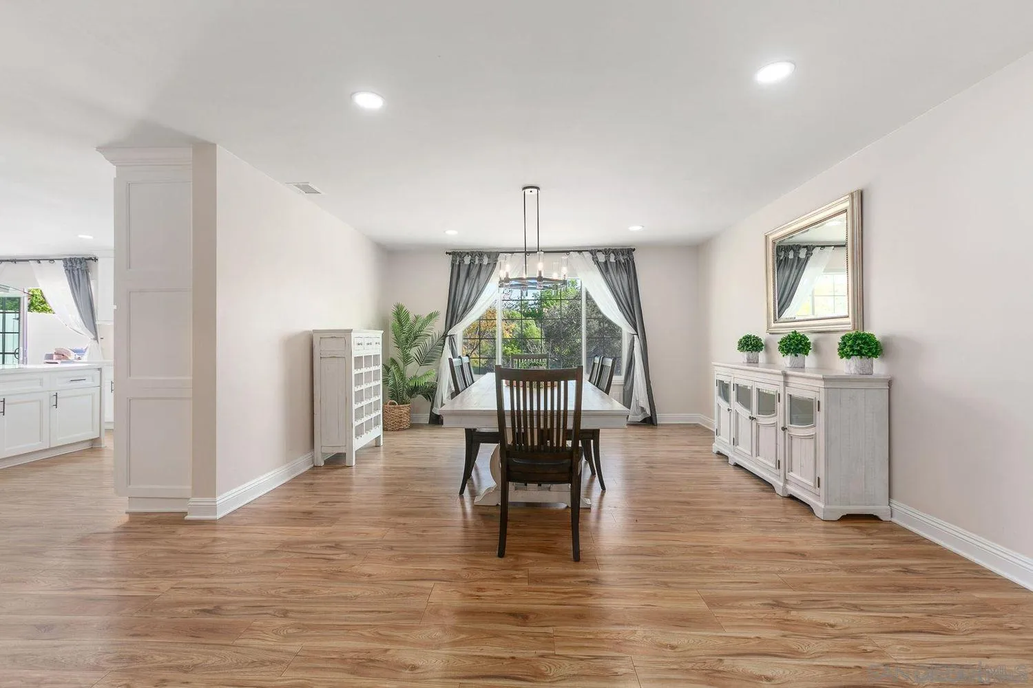 9431 West Lilac Road Escondido, CA 92026 - Photo 9 of 62 a dining room with furniture window and wooden floor