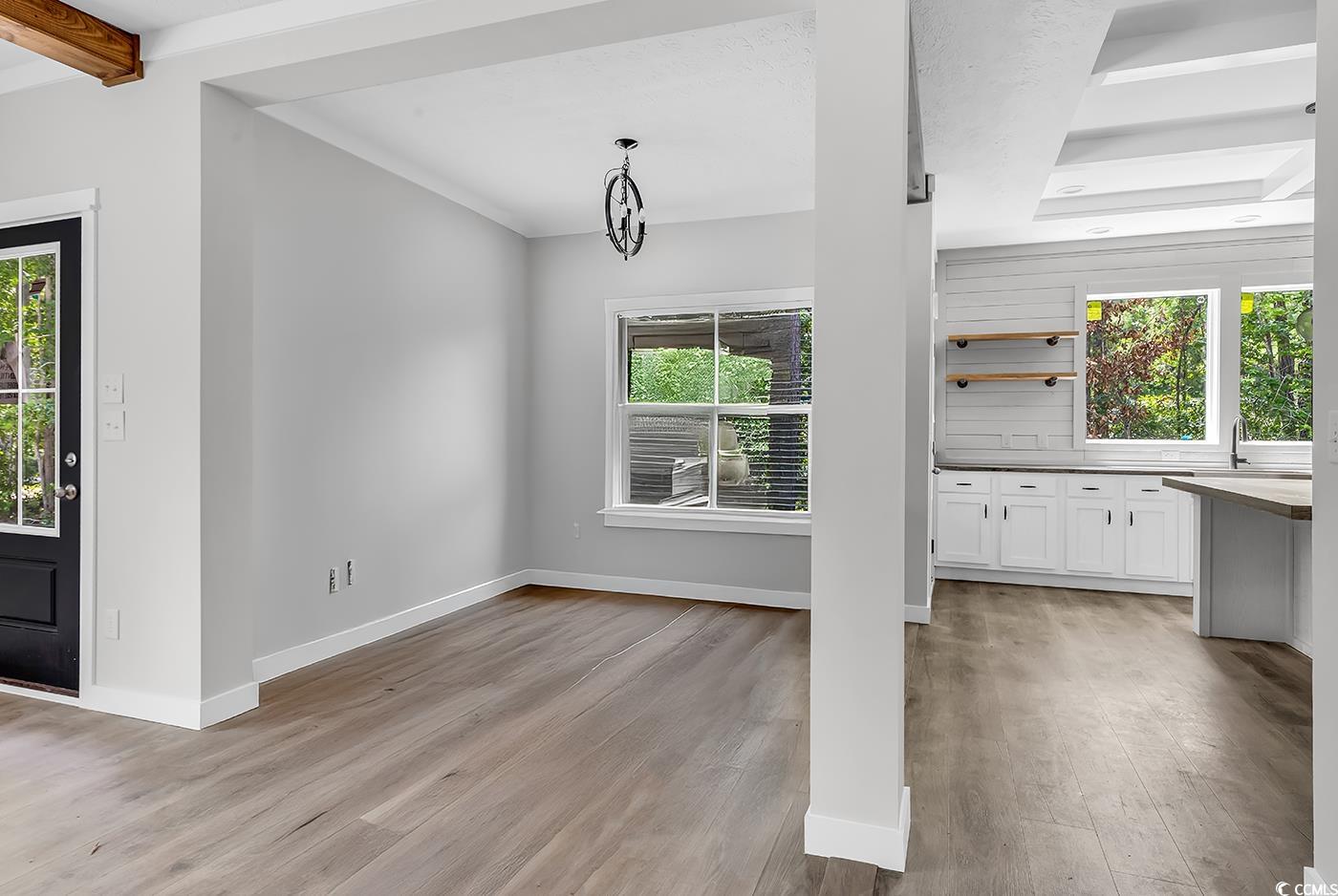 754 Kent Road Andrews, SC 29510 - Photo 12 of 31 Kitchen with butcher block countertops, open shelves, appliances with stainless steel finishes, wall chimney exhaust hood, and white cabinetry