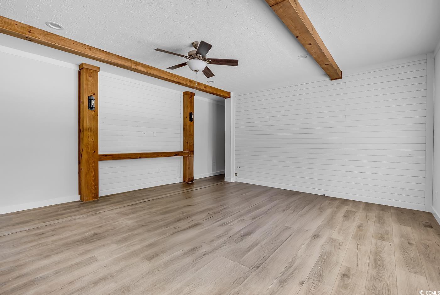754 Kent Road Andrews, SC 29510 - Photo 14 of 31 Unfurnished dining area with beam ceiling and light wood-style floors
