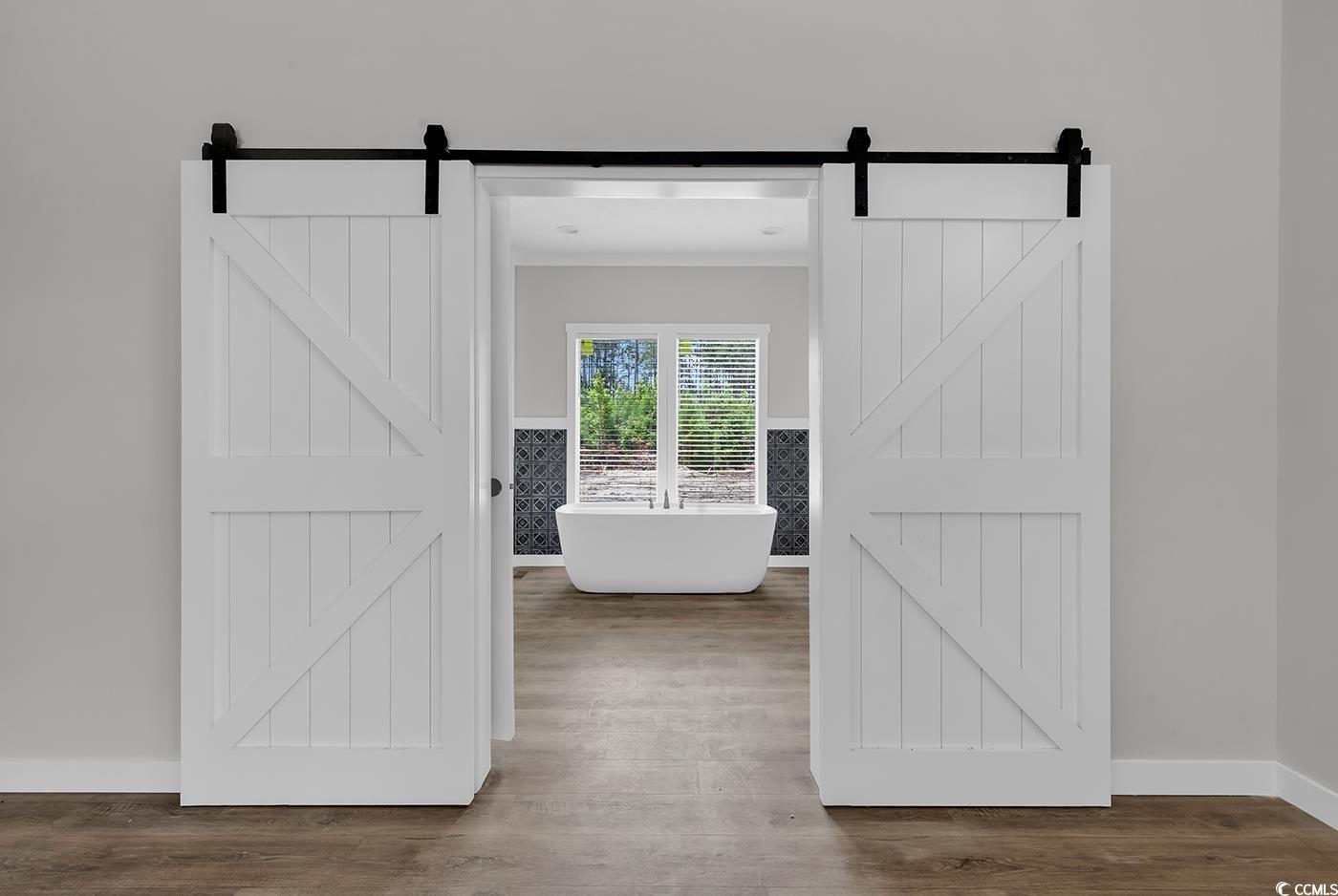 754 Kent Road Andrews, SC 29510 - Photo 25 of 31 Bedroom featuring light wood-style floors, crown molding, and a textured ceiling