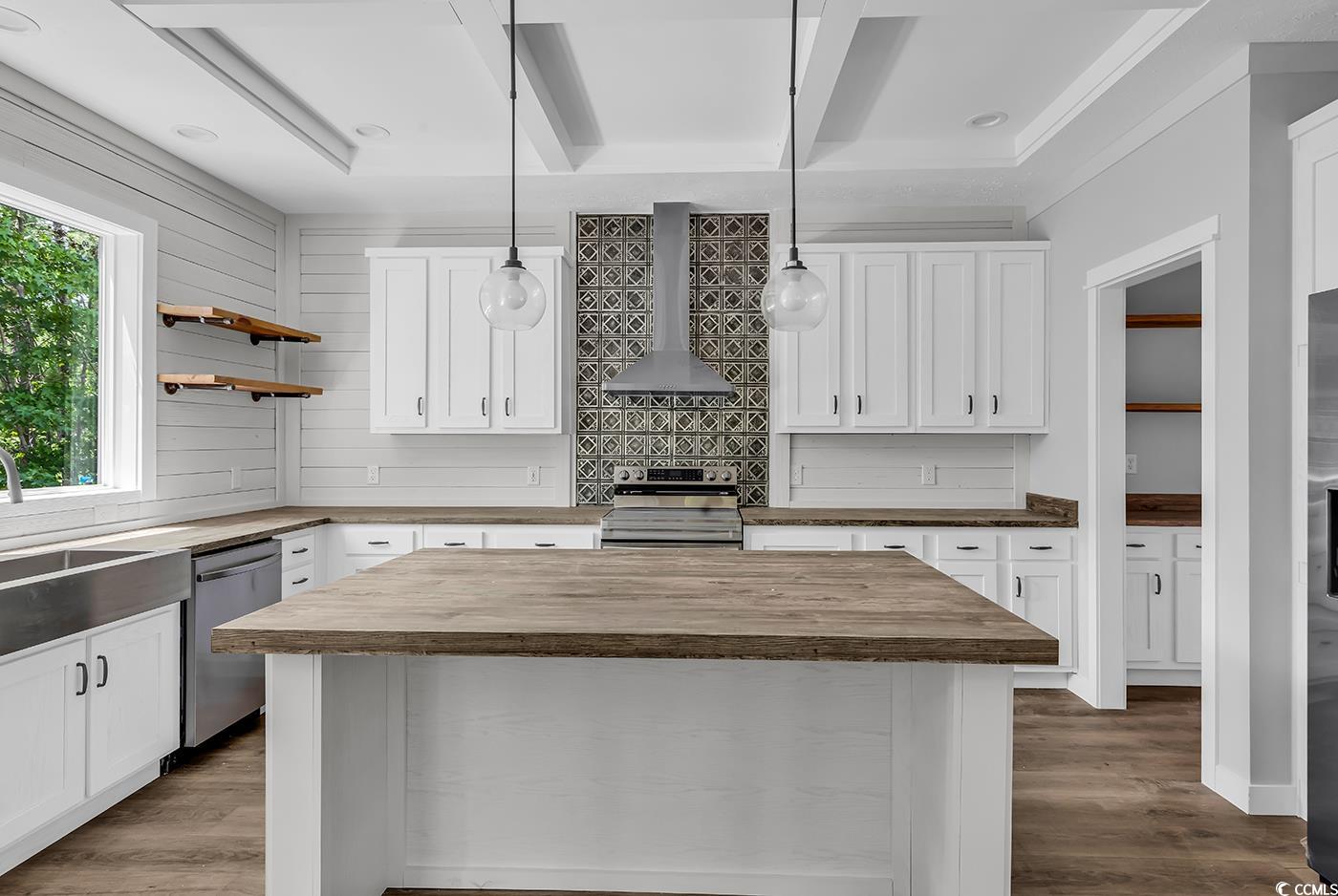 754 Kent Road Andrews, SC 29510 - Photo 8 of 31 Unfurnished living room featuring beam ceiling, a ceiling fan, a textured ceiling, and light wood-style floors