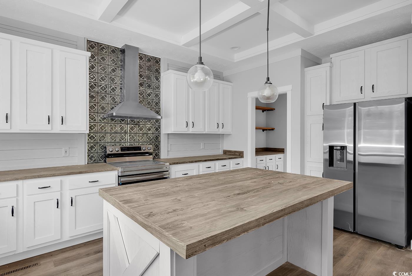 754 Kent Road Andrews, SC 29510 - Photo 9 of 31 Kitchen with open shelves, butcher block countertops, white cabinets, coffered ceiling, and beamed ceiling