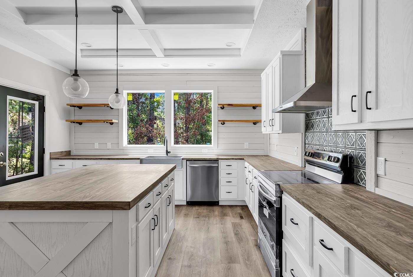 754 Kent Road Andrews, SC 29510 - Photo 10 of 31 Kitchen with hanging light fixtures, white cabinets, and butcher block countertops