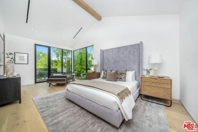 a view of a patio with table and chairs and potted plants