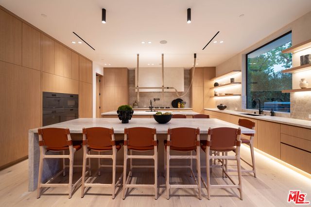 a view of swimming pool with chairs