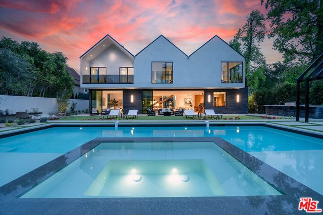 a view of swimming pool with outdoor seating