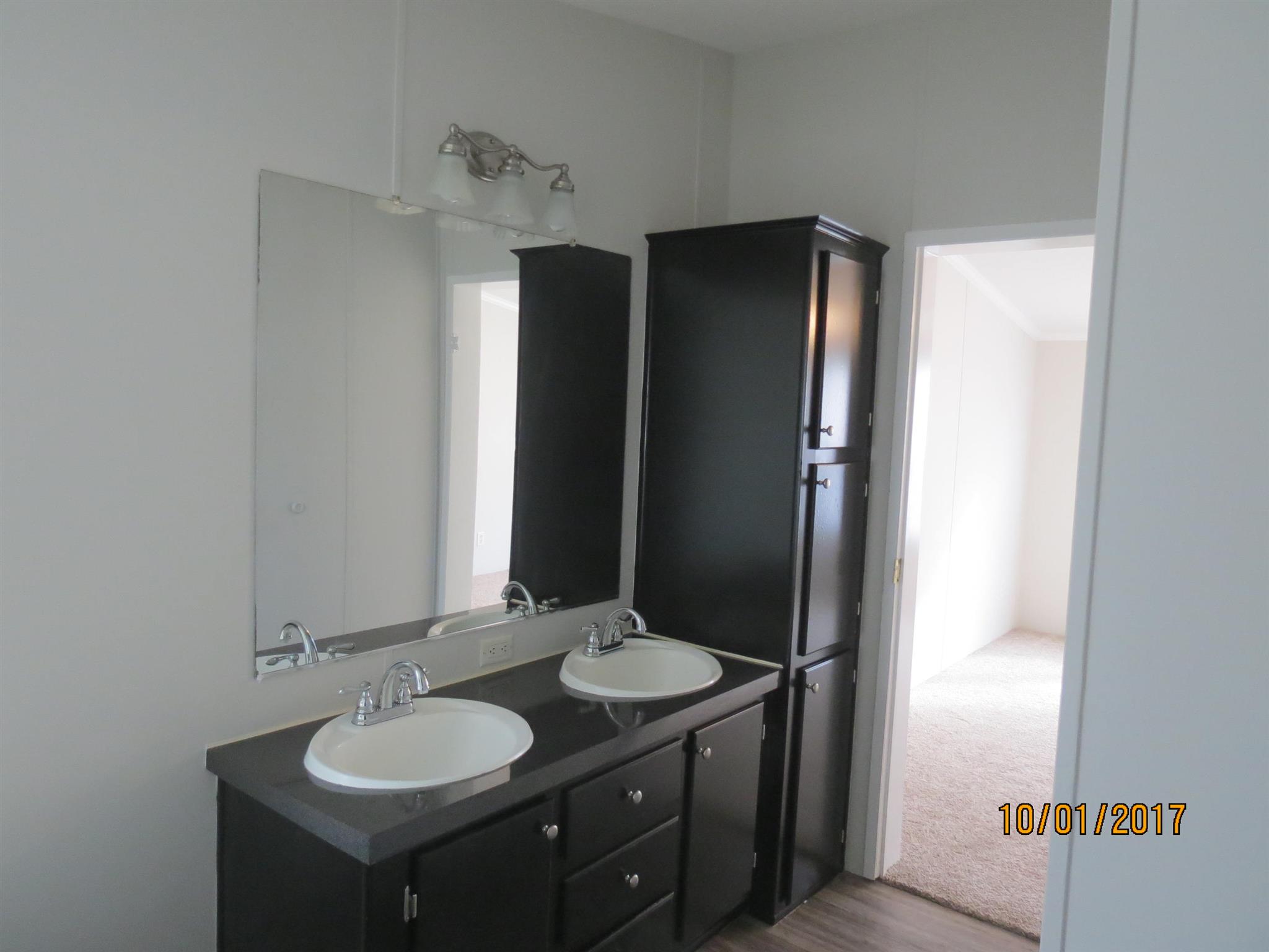 3294 Cedar Grove Road Lebanon, TN 37087 - Photo 14 of 25 a bathroom with a granite countertop sink and a mirror