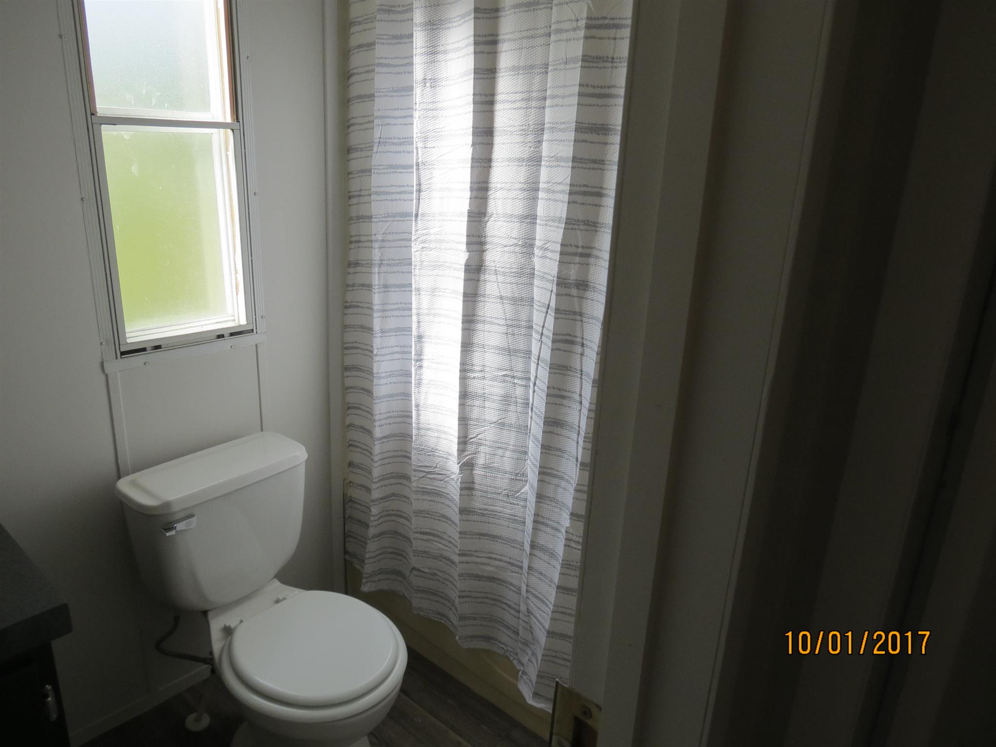 3294 Cedar Grove Road Lebanon, TN 37087 - Photo 17 of 25 a white toilet sitting next to a window in a bathroom
