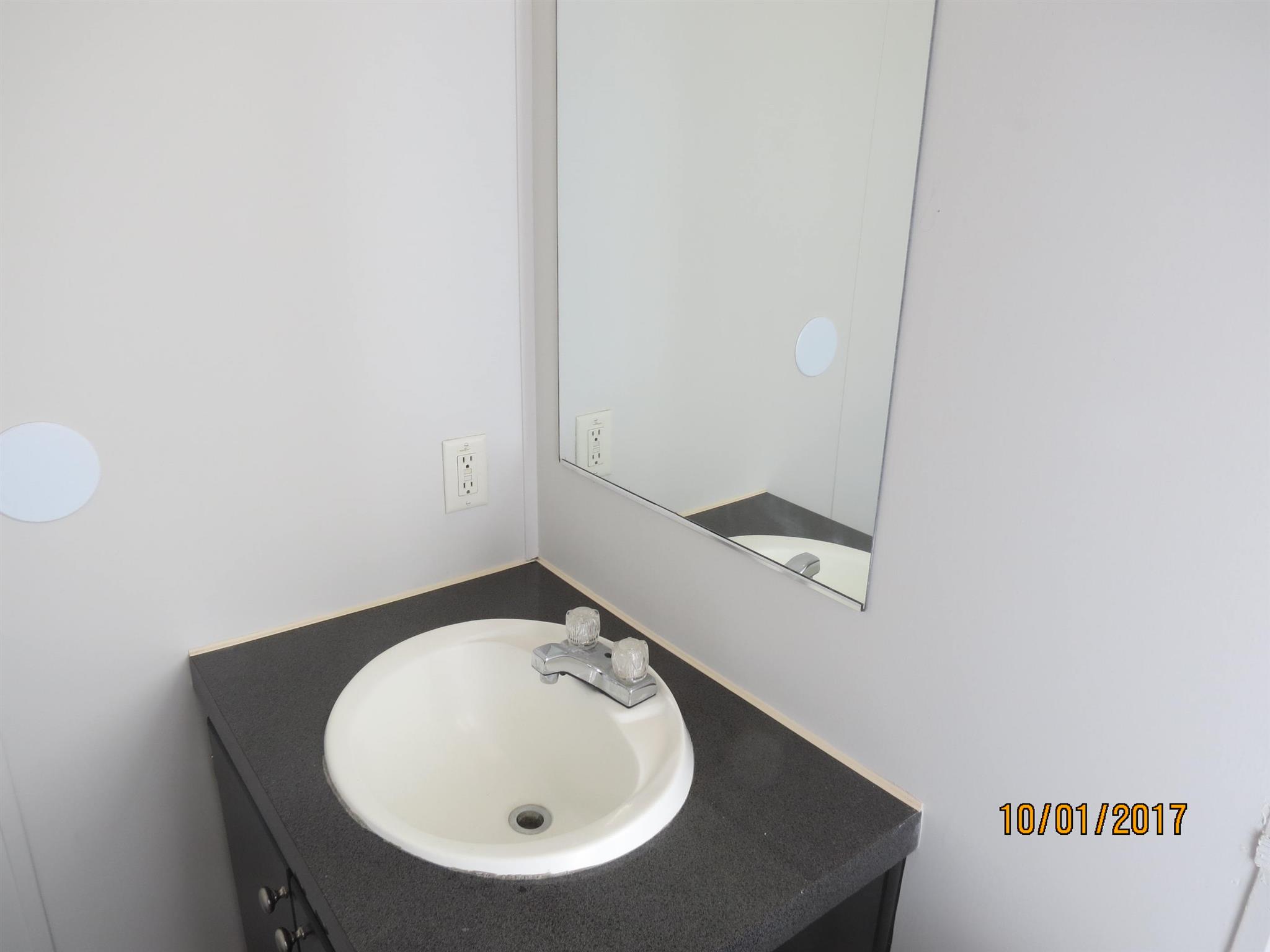 3294 Cedar Grove Road Lebanon, TN 37087 - Photo 18 of 25 a bathroom with a sink and a mirror