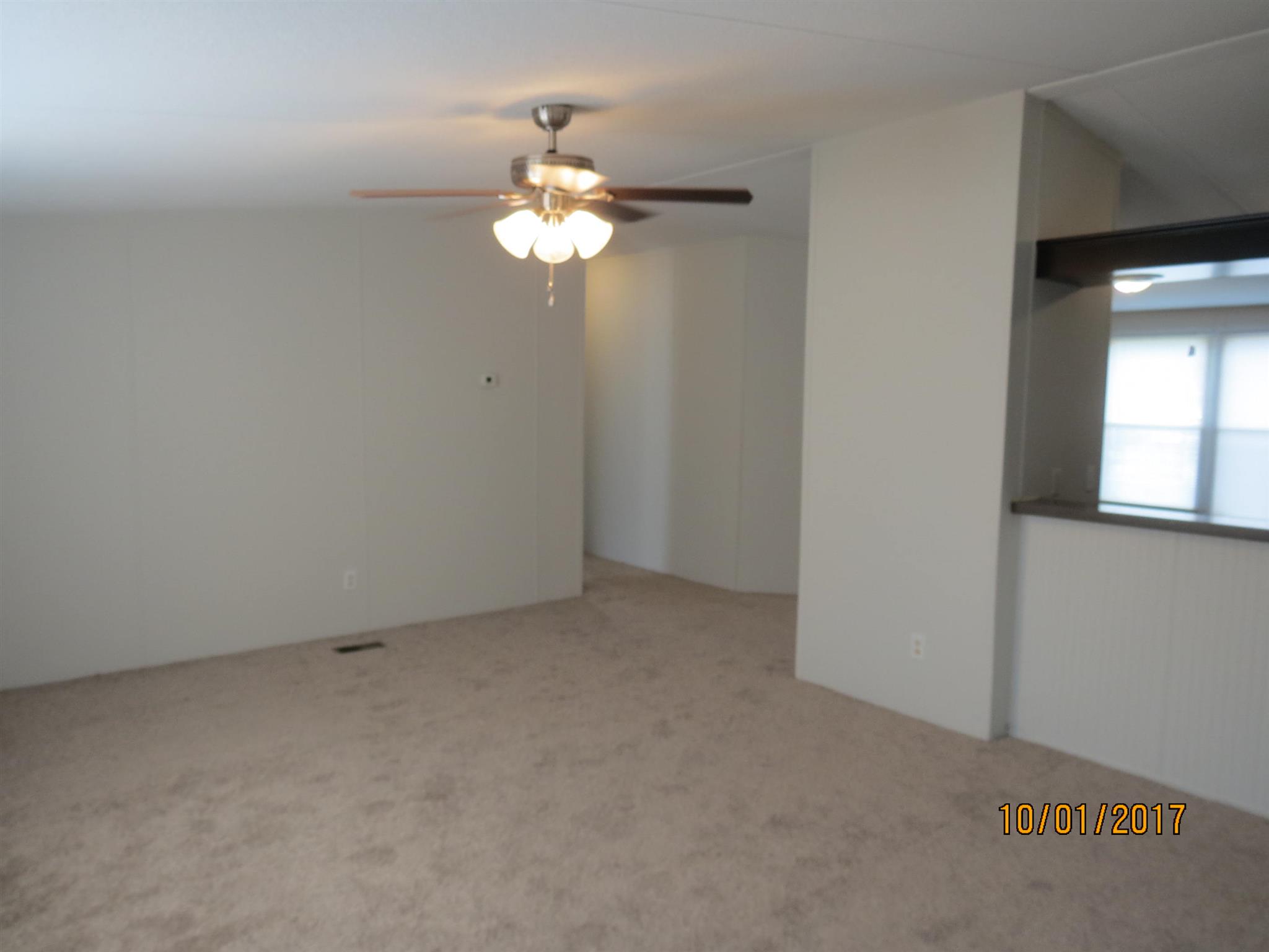 3294 Cedar Grove Road Lebanon, TN 37087 - Photo 6 of 25 an empty room with a chandelier fan