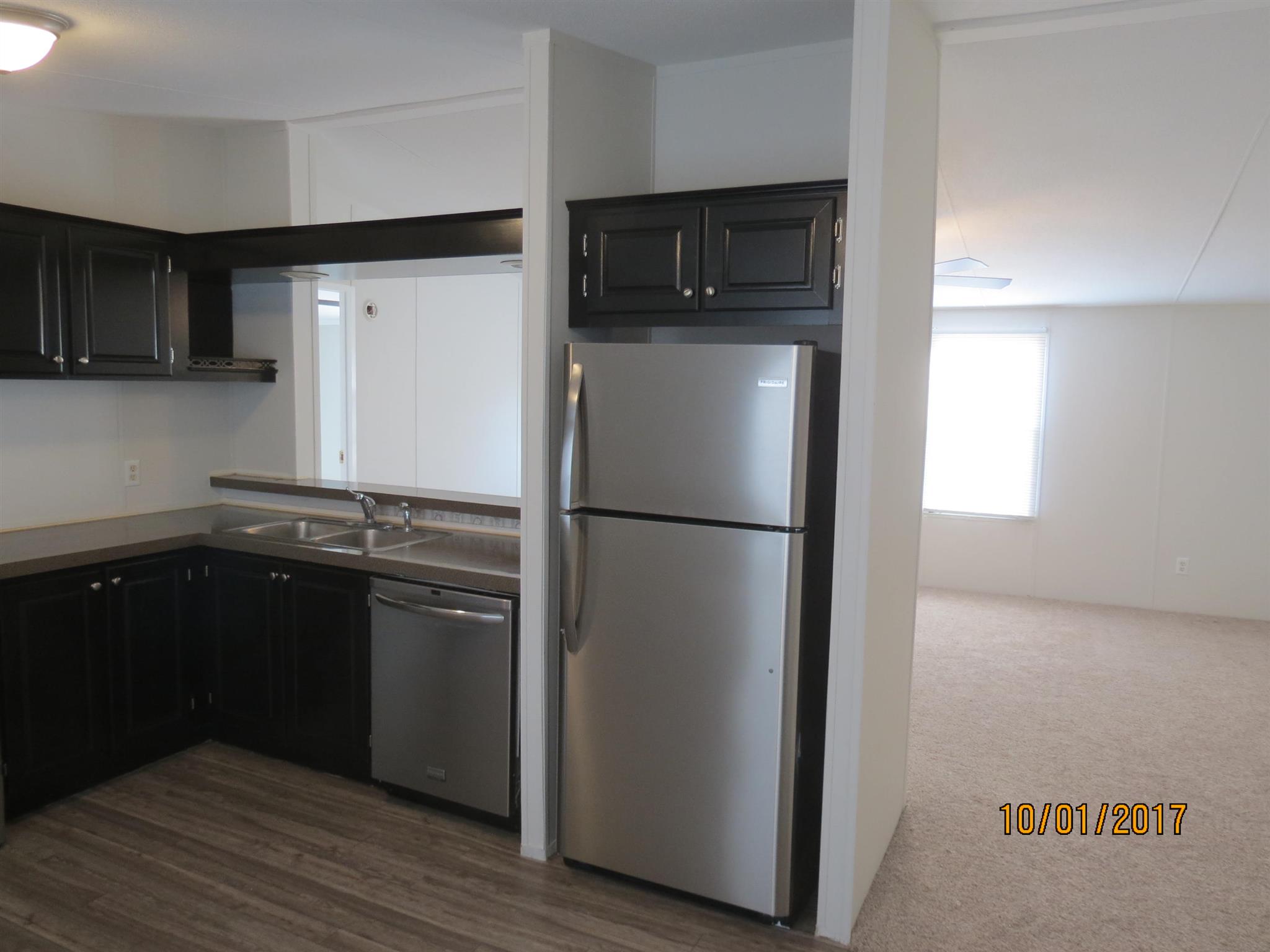 3294 Cedar Grove Road Lebanon, TN 37087 - Photo 7 of 25 a kitchen with a refrigerator and a stove top oven