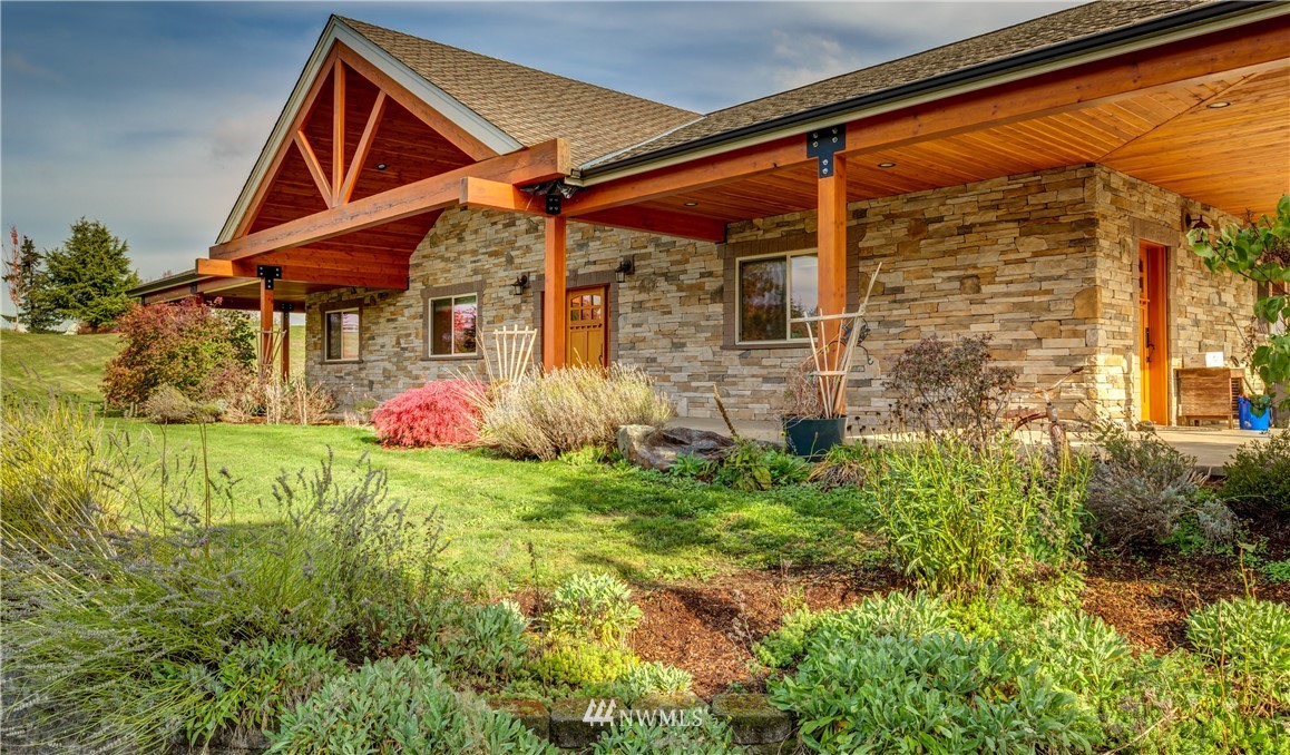 6460 Everson Goshen Road Everson, WA 98247 - Photo 1 of 37 a front view of a house with garden