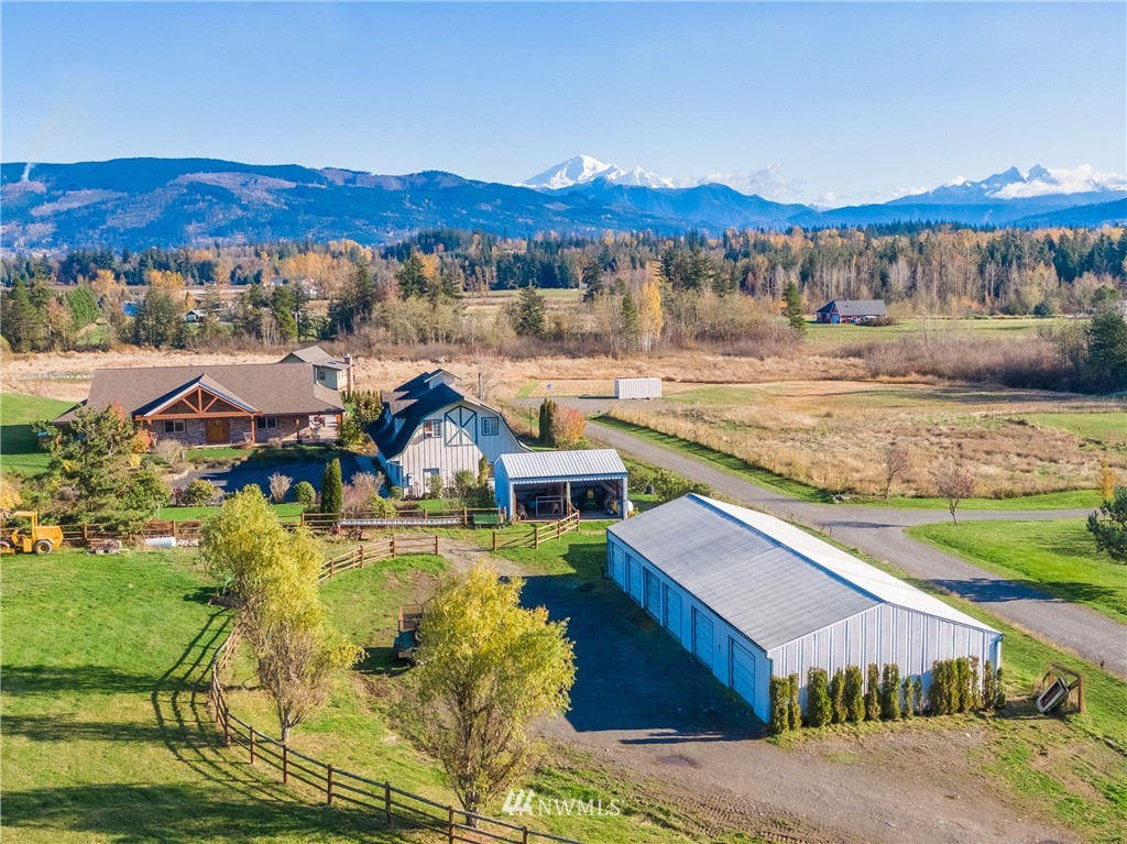 6460 Everson Goshen Road Everson, WA 98247 - Photo 2 of 37 a view of a swimming pool with a lake view