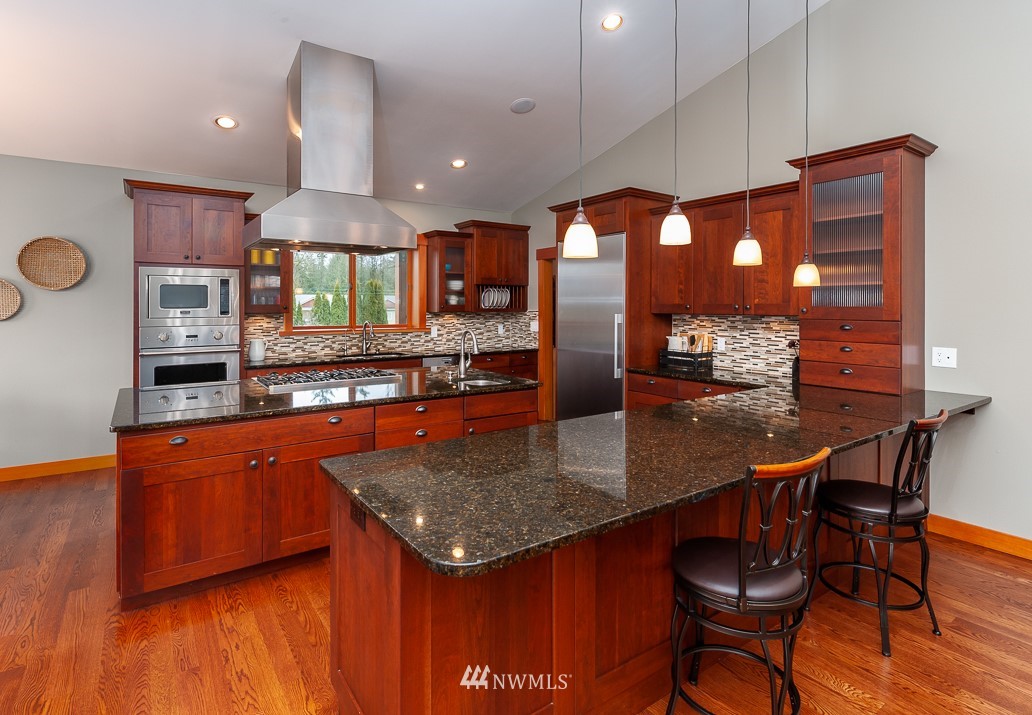 6460 Everson Goshen Road Everson, WA 98247 - Photo 12 of 37 a kitchen with stainless steel appliances granite countertop counter top space a sink and cabinets