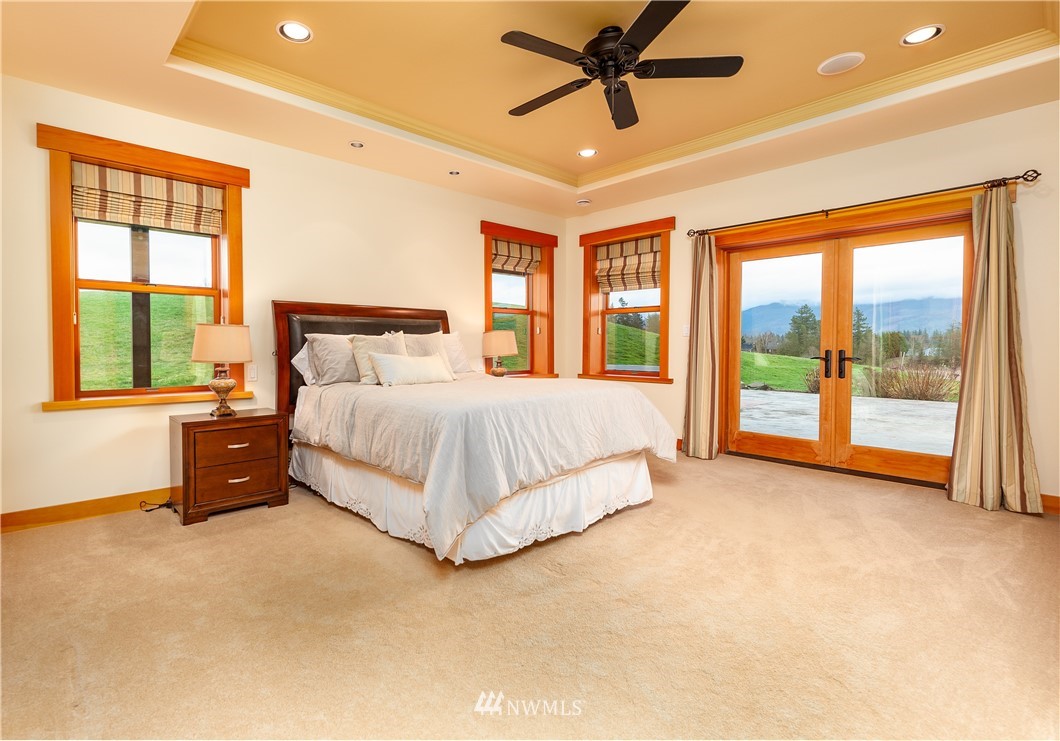 6460 Everson Goshen Road Everson, WA 98247 - Photo 13 of 37 a bedroom with a large bed and a large window