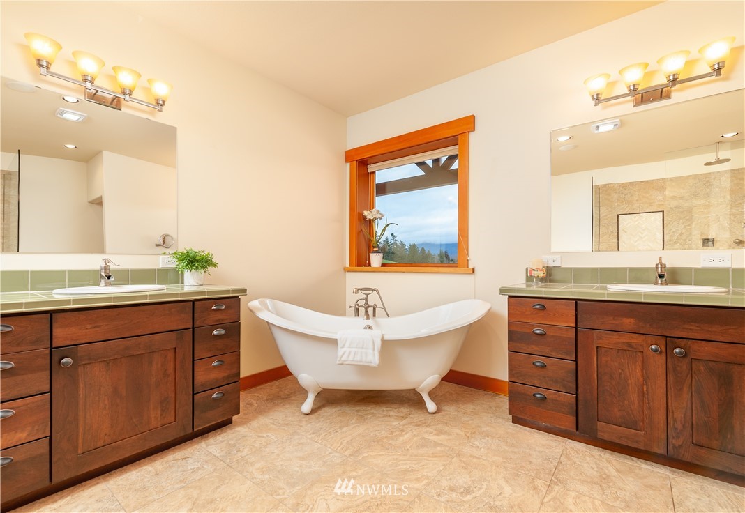 6460 Everson Goshen Road Everson, WA 98247 - Photo 15 of 37 a spacious bathroom with a granite countertop sink mirror and bathtub