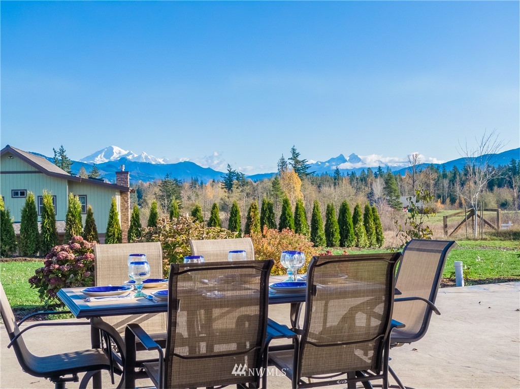 6460 Everson Goshen Road Everson, WA 98247 - Photo 22 of 37 a view of a chairs and table in patio