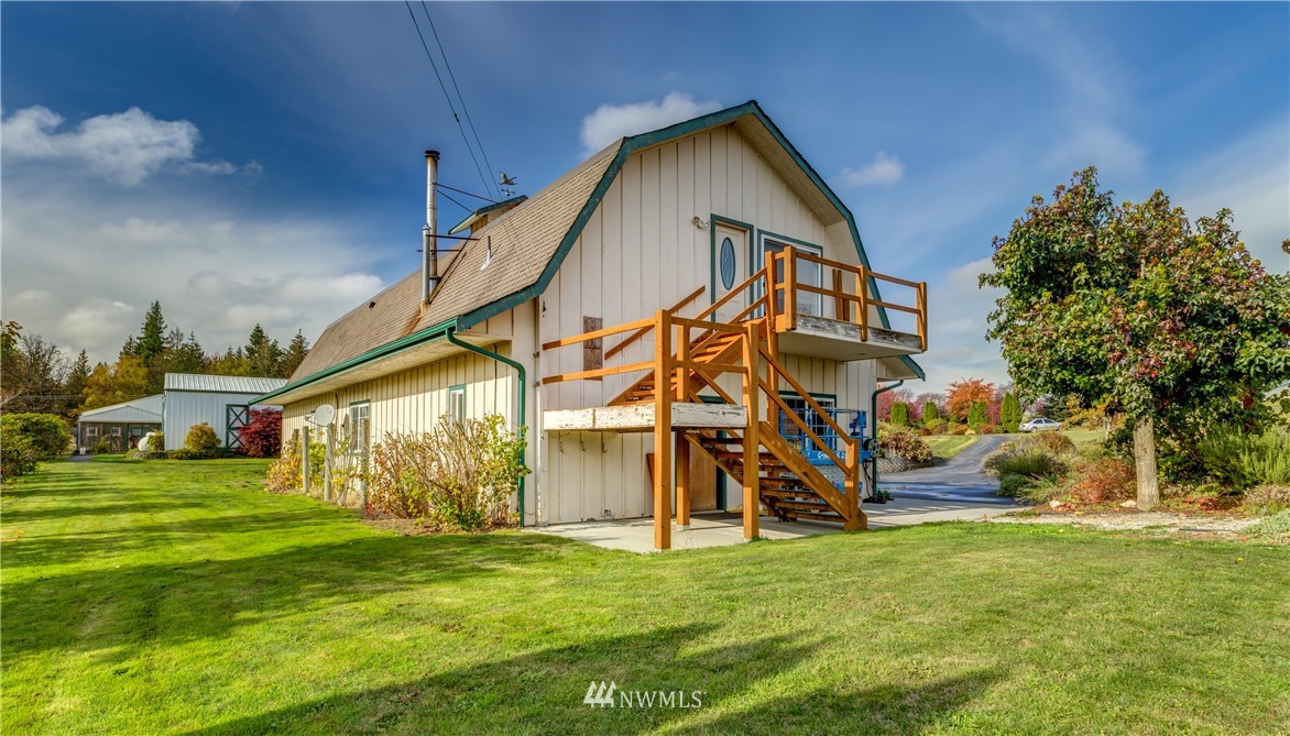6460 Everson Goshen Road Everson, WA 98247 - Photo 31 of 37 a view of an house with a big yard and potted plants