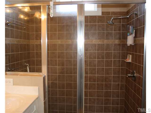 1204 Harp Street Raleigh, NC 27604 - Photo 16 of 25 a bathroom with a shower