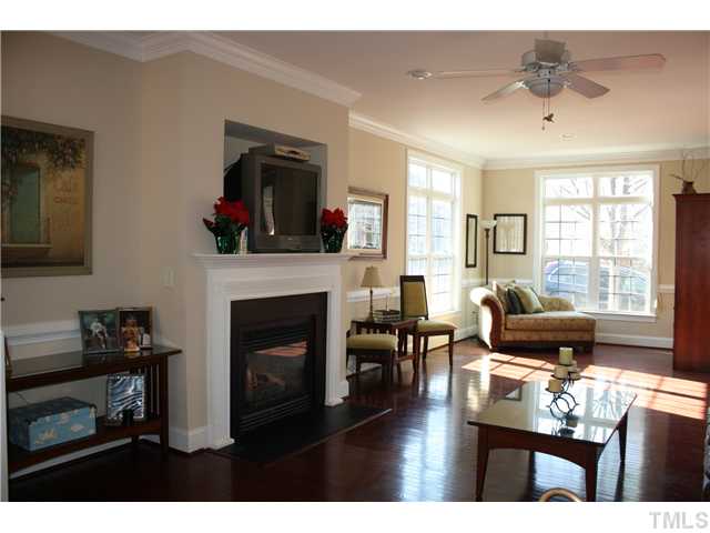 1204 Harp Street Raleigh, NC 27604 - Photo 6 of 25 a living room with furniture fireplace and flat screen tv