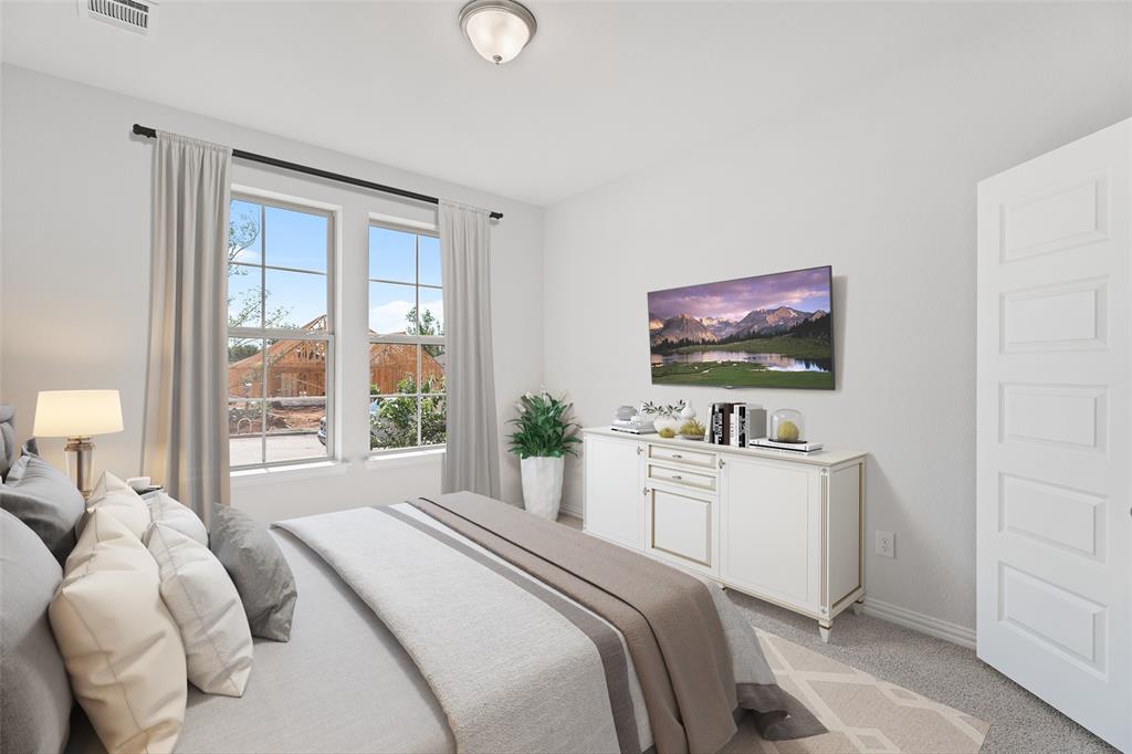 715 Soprano Drive Forney, TX 75126 - Photo 14 of 16 a bedroom with a bed and a flat screen tv