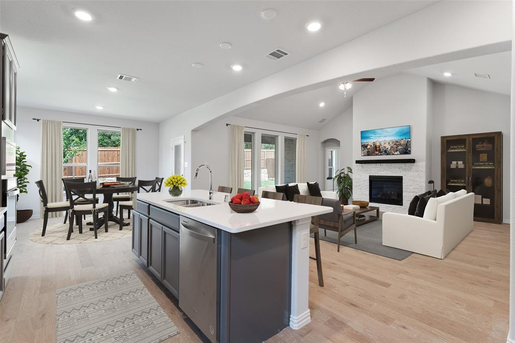 715 Soprano Drive Forney, TX 75126 - Photo 6 of 16 a living room with fireplace furniture and a table